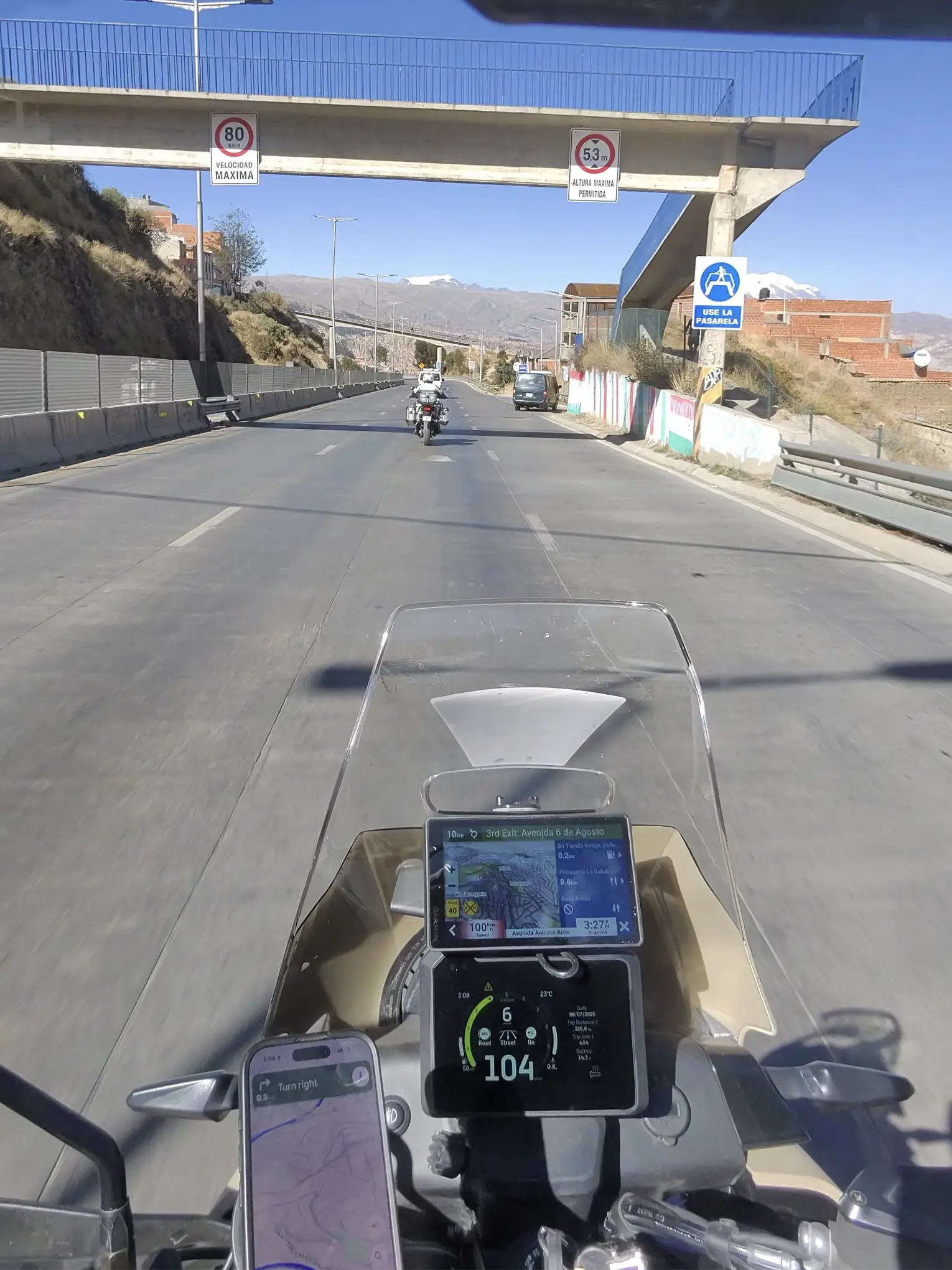 Rider’s perspective on Andean highway during motorcycle trip from Santa Cruz de la Sierra to Lima