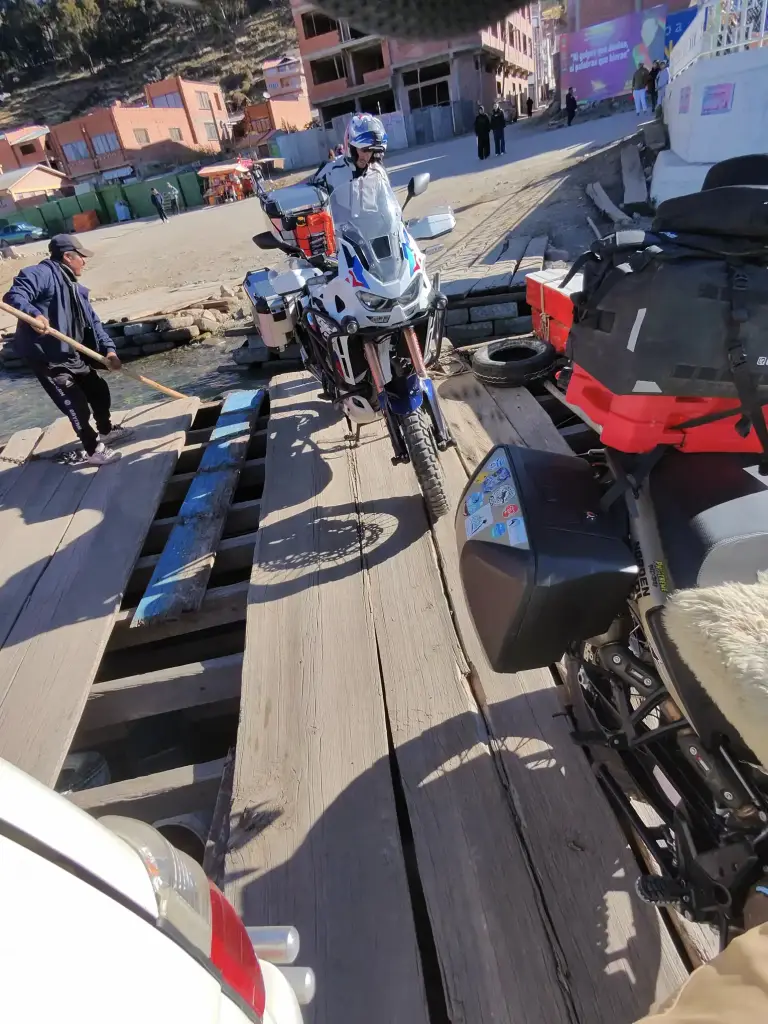 Motorcycles crossing Lake Titicaca on a ferry during motorcycle trip from Santa Cruz de la Sierra to Lima