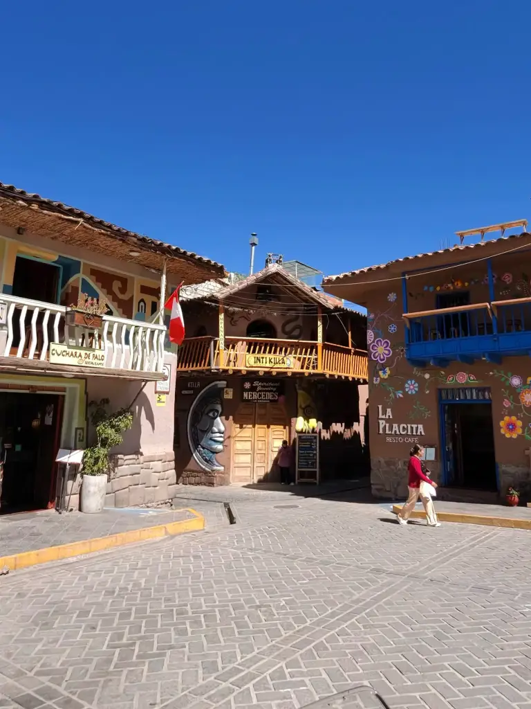 Cobblestone street and colorful houses of an Andean village visited on a motorcycle trip.